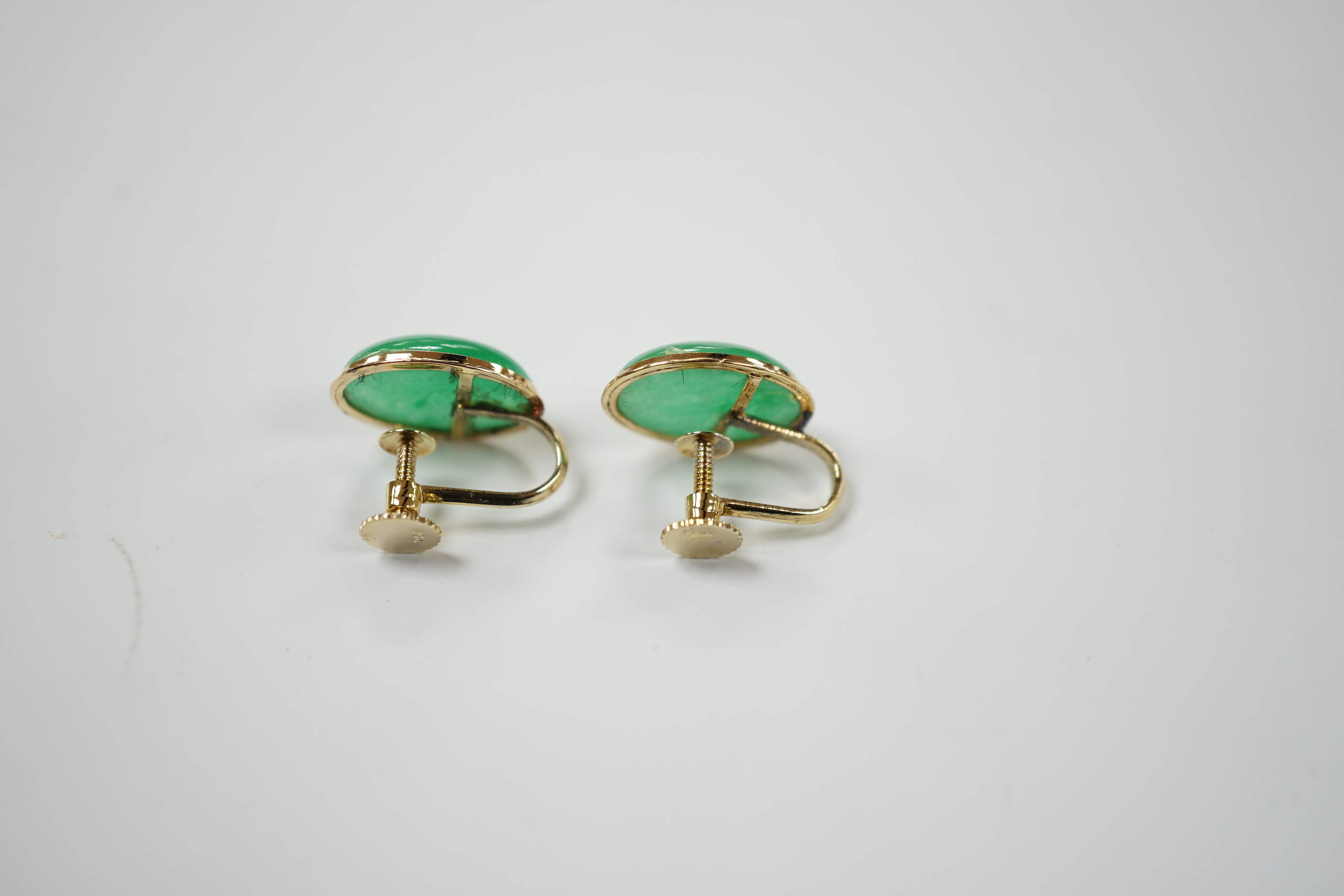 A pair of yellow metal mounted jade earrings, in associated Garrard box